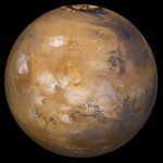 Вид Марса (коллаж) сделанный из серии снимков с широкоугольной камеры Mars Global Surveyor. Бледно-голубоватые облака висят над областью Тарсис, представляющей собой огромное вулканическое нагорье.
Вид Марса (коллаж) сделанный из серии снимков с широкоугольной камеры Mars Global Surveyor. Бледно-голубоватые облака висят над областью Тарсис, представляющей собой огромное вулканическое нагорье.